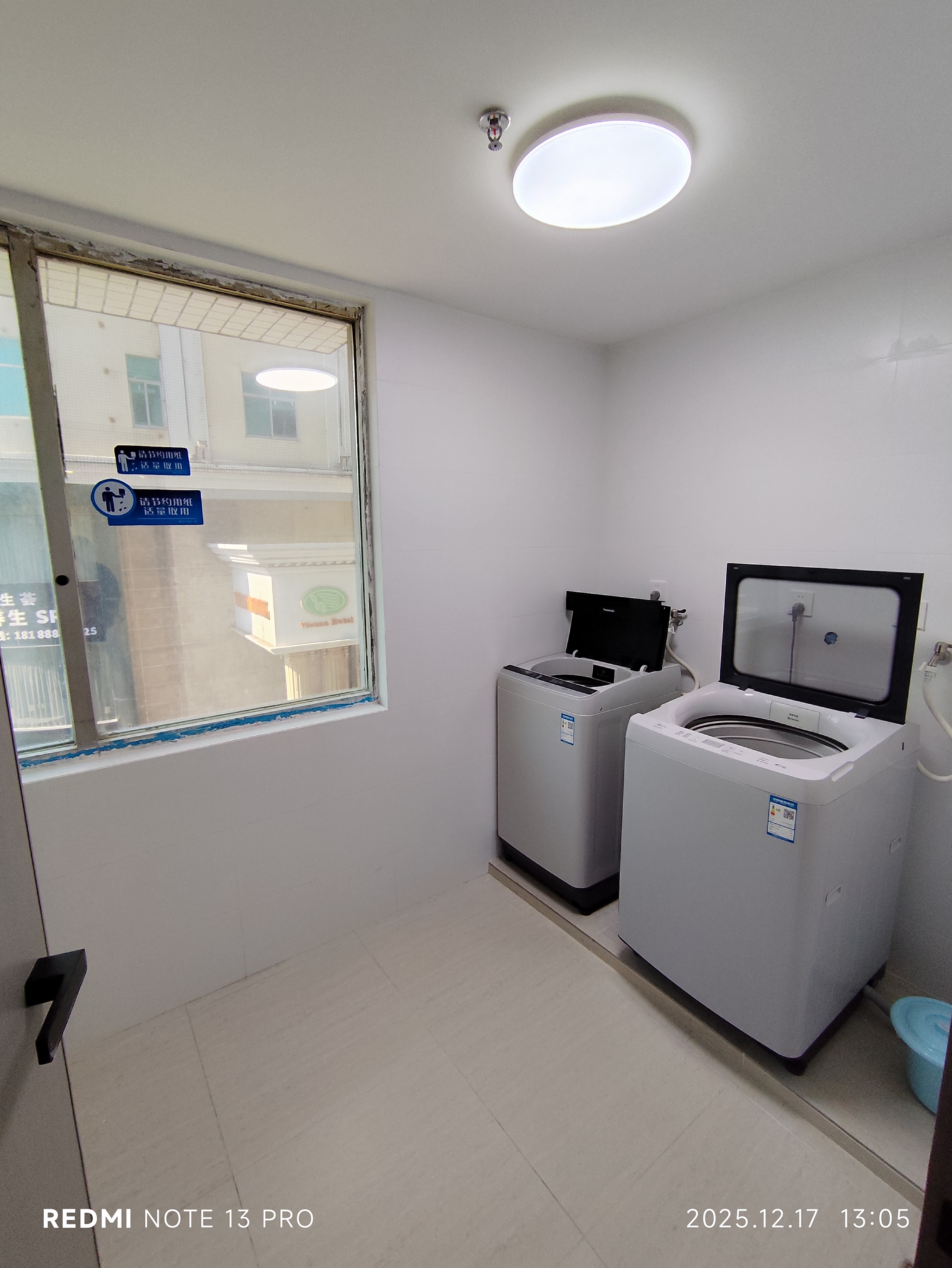 Row of washing machines in a laundry room