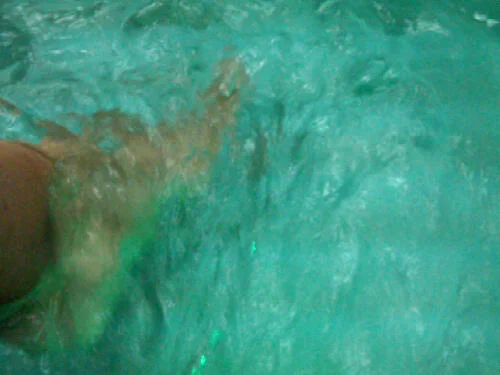 Therapist hands during a relaxing spa wellness treatment session.